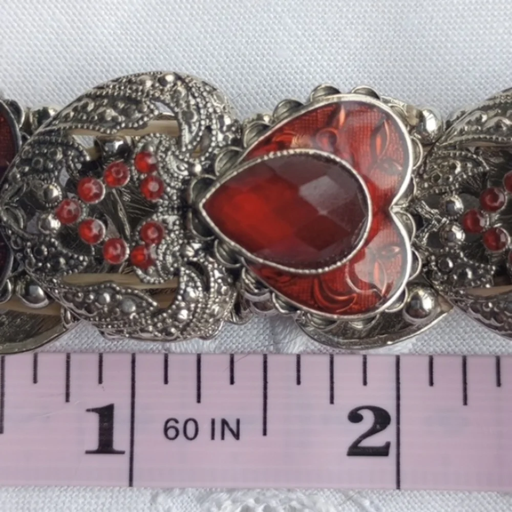 Red enamel and rhinestone encrusted silvertone heart-shaped stretchy bracelet
